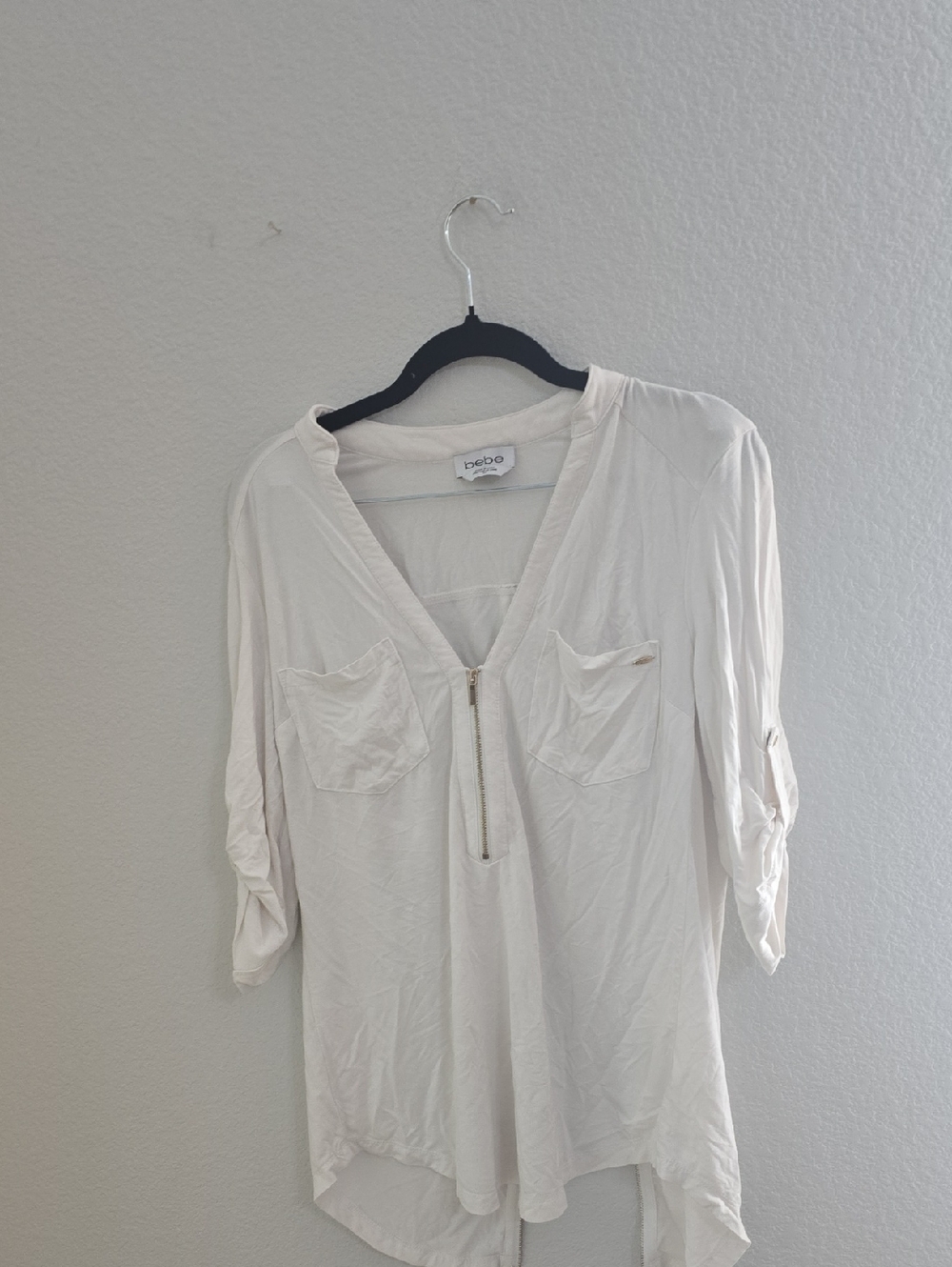 bebe Ivory V-Neck Zip Front Roll-Tab Blouse